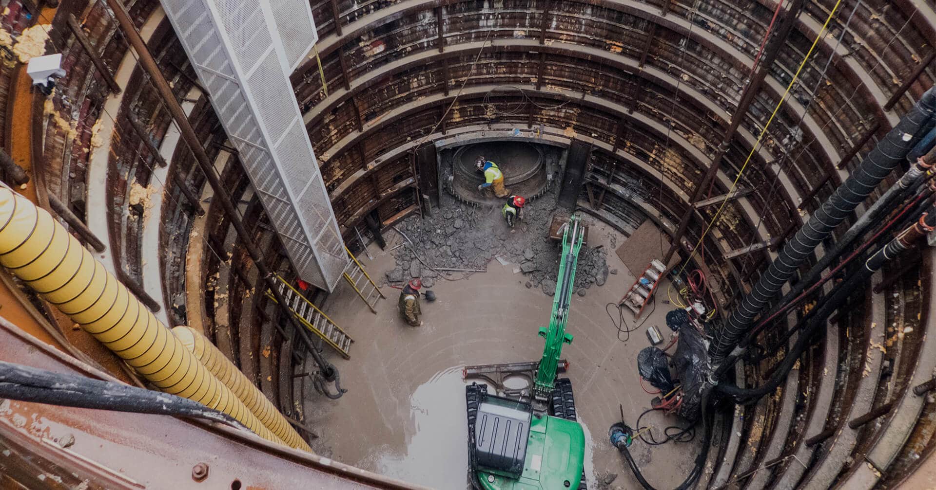 Workers in a deep tunneling trench